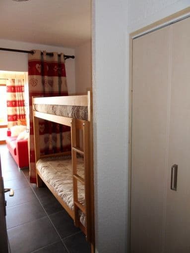 Beds separated by a curtain